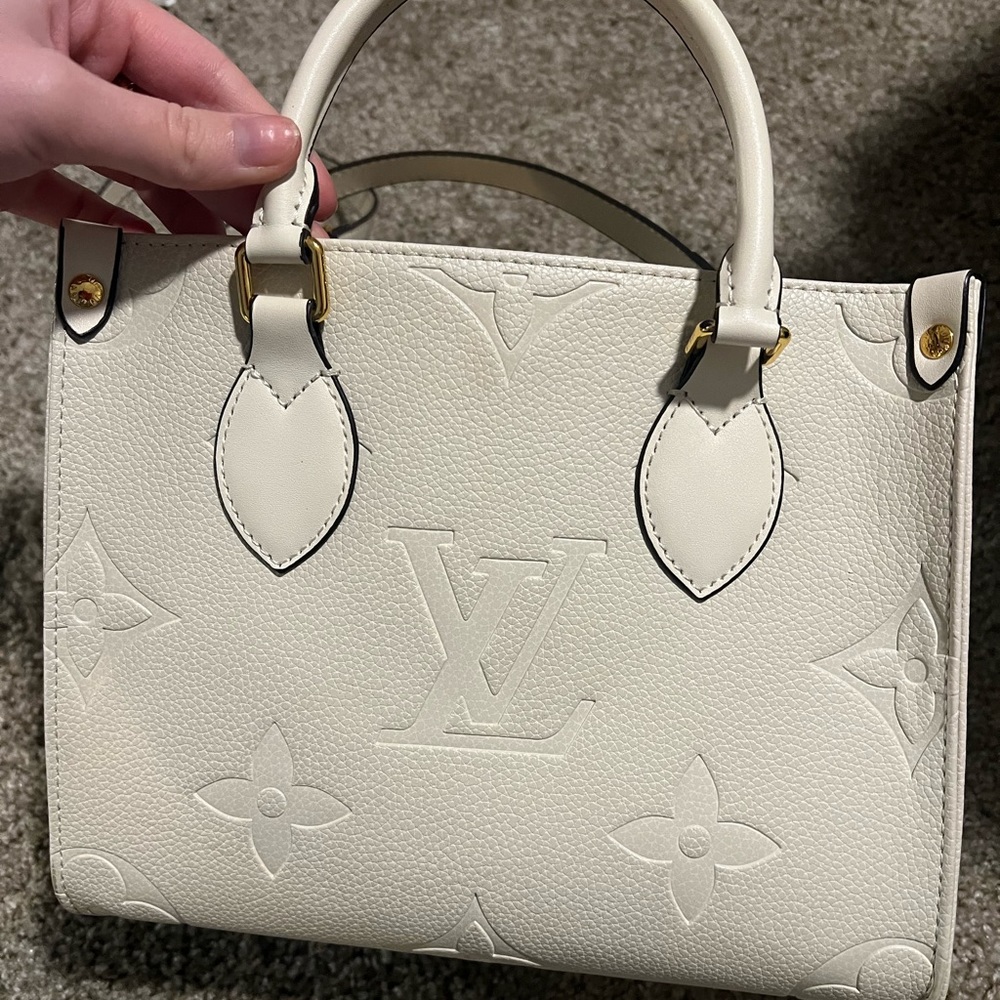 louis vuitton mini purse, slightly used but no wear and tear! i love her